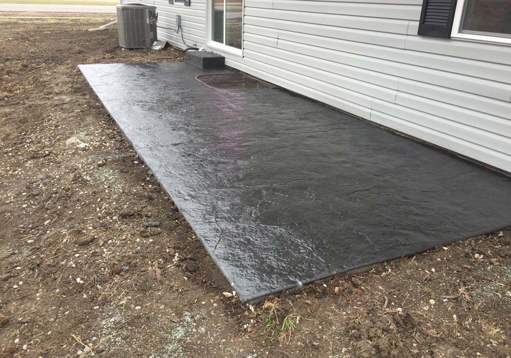Stamped concrete patio with decorative pattern — east KC metro residential project